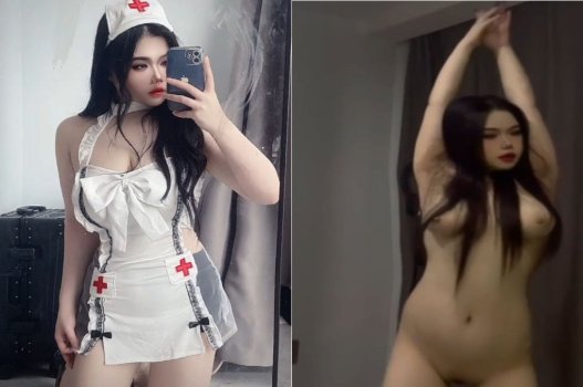 Nữ y tá chăm sóc bệnh nhân có bộ ngực lớn